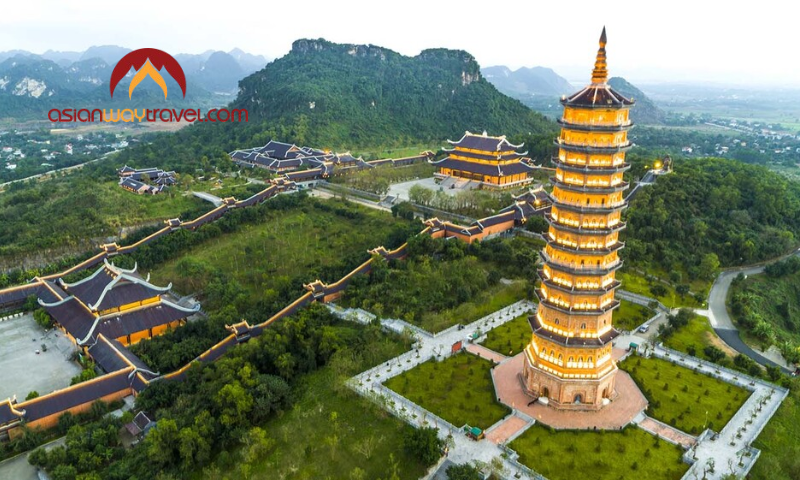 Bai Dinh Pagoda’s illuminated tower amid Ninh Binh’s limestone mountains