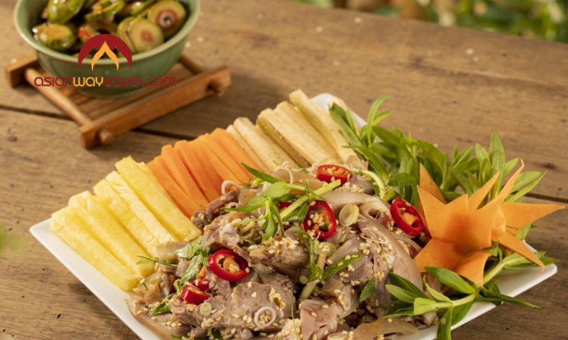 Fresh Vietnamese goat salad with herbs, chili, and tropical fruits