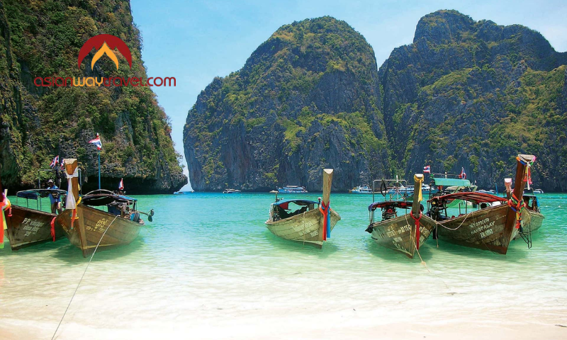 Long-tail boats on a tropical beach in Thailand