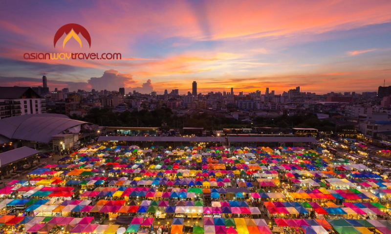 Colorful Bangkok night market at sunset