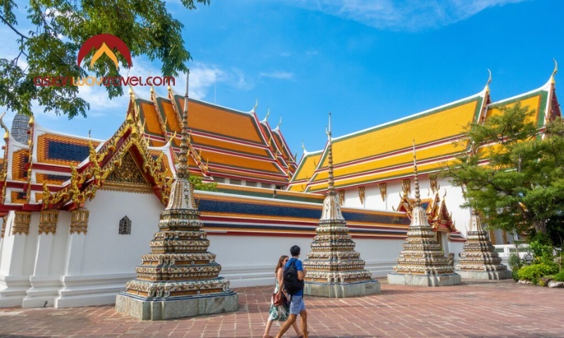 Exploring Bangkok’s historic temples under a bright blue sky